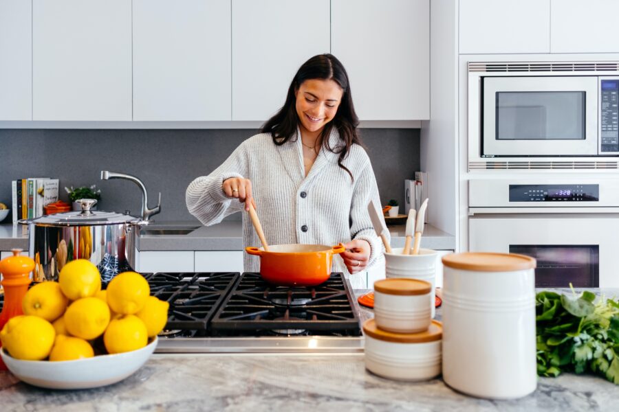 Women cooking with her kitchen appliances